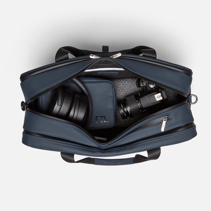 The best gym and work bag featuring organized compartments for headphones, camera gear, and accessories in a sleek zip-top design. Abbot Green,Kenmare Black,Essex Blue, Stone Grey